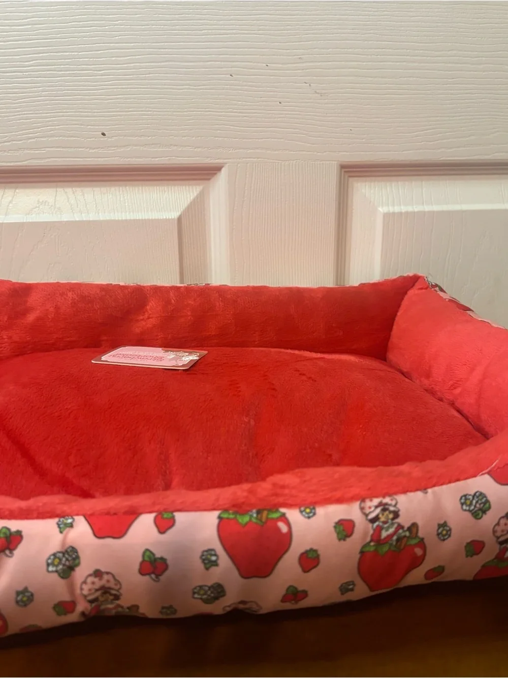 Plush Red Small Pet Bed with Strawberry-Patterned Border